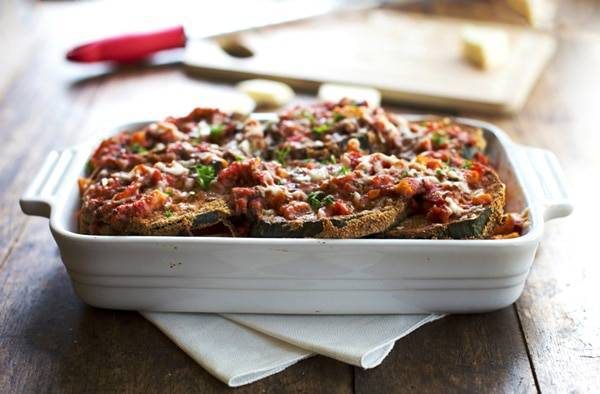 Baked Zucchini Parmesan in a white baking dish.