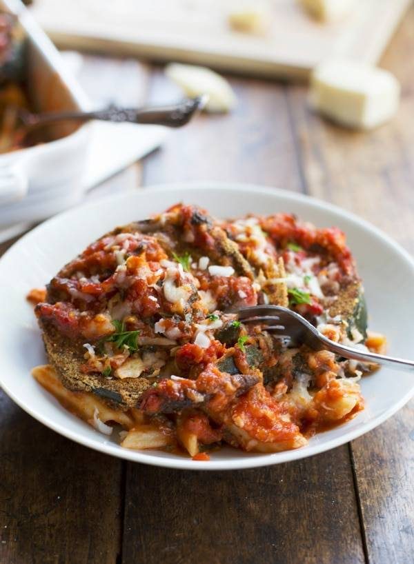 Baked Zucchini Parmesan on a white plate.