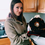 Lindsay holding a burned bundt cake.