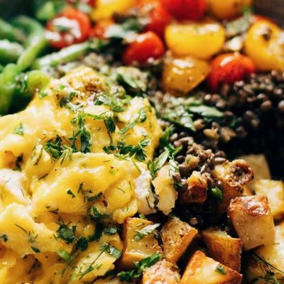 Lentil Bowl with scrambled eggs, potatoes, green beans, and tomatoes.