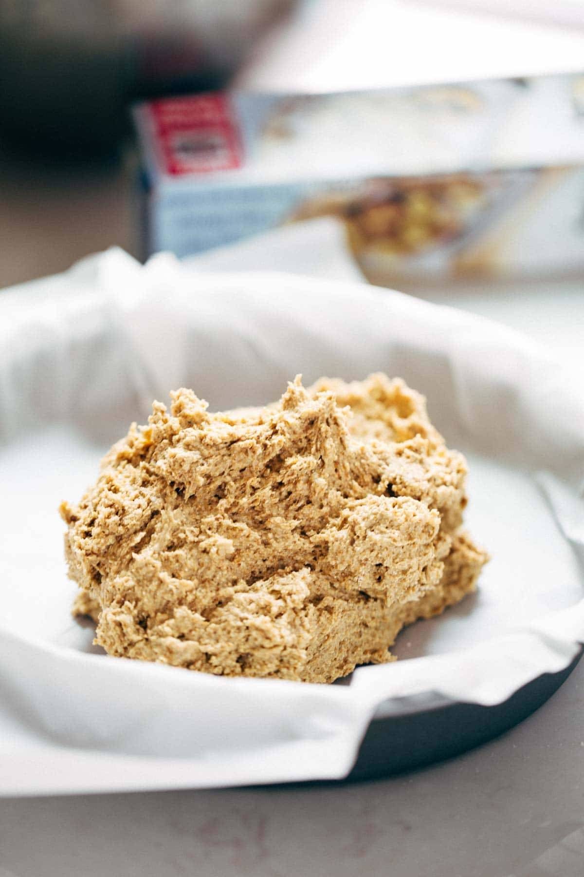 A plate holding dough for preparation of a cake.