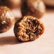 Pecan pie energy bite with a bite taken out of it