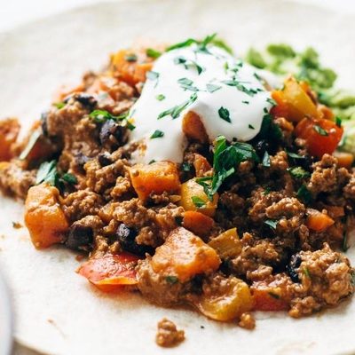 Chipotle Turkey Burrito held by hands.