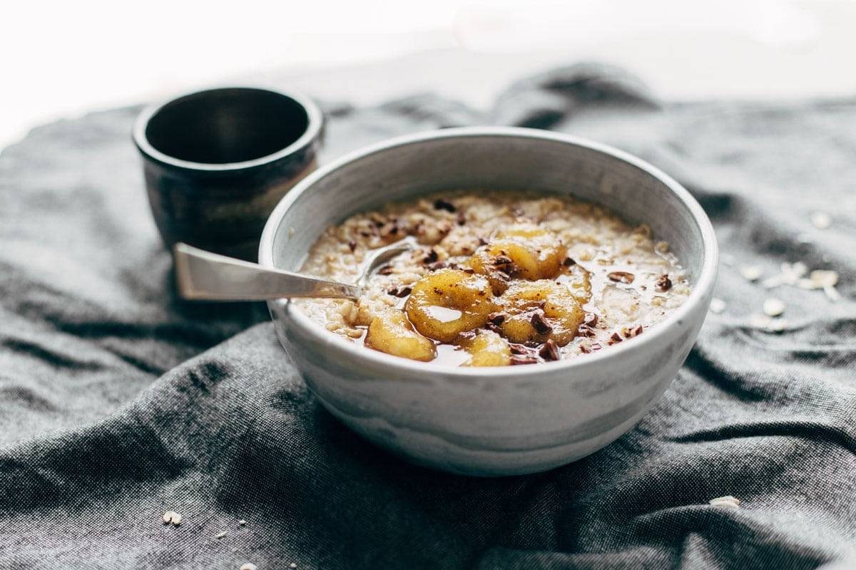 Caramelized Banana Oatmeal! Creamy oatmeal with bananas in a maple syrup/coconut oil glaze. No refined sugar! | pinchofyum.com