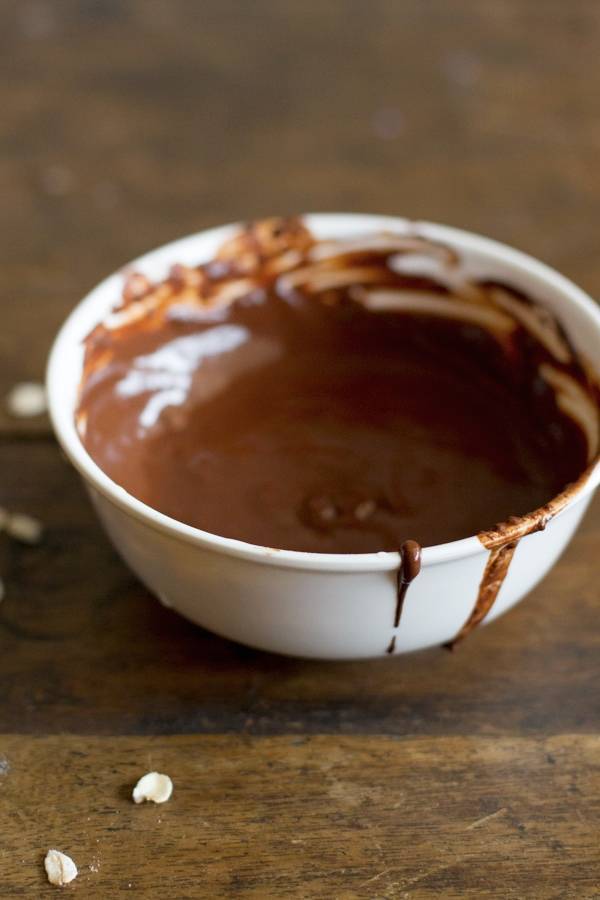 Melted chocolate in a white bowl.