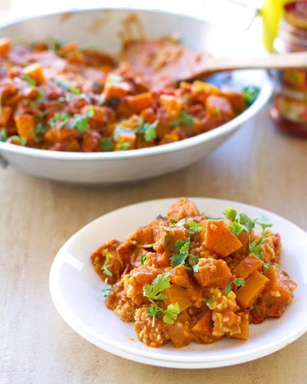 Squash coconut curry on a plate.