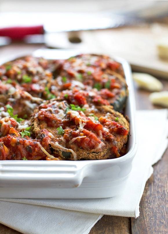 Baked Zucchini Parmesan in a white baking dish.
