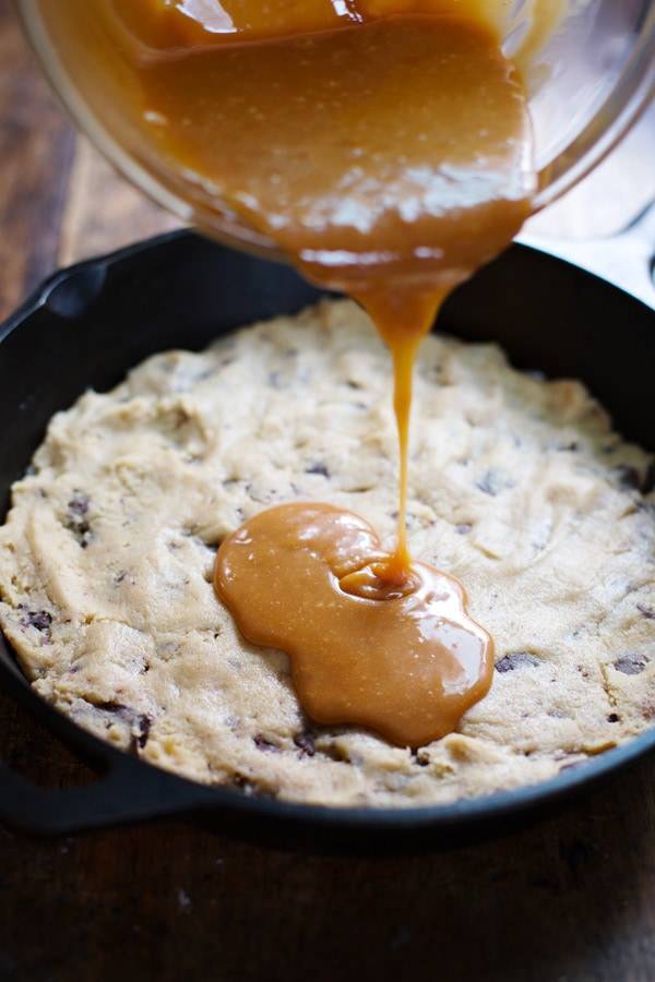 Deep dish chocolate chip cookie with caramel drizzle.
