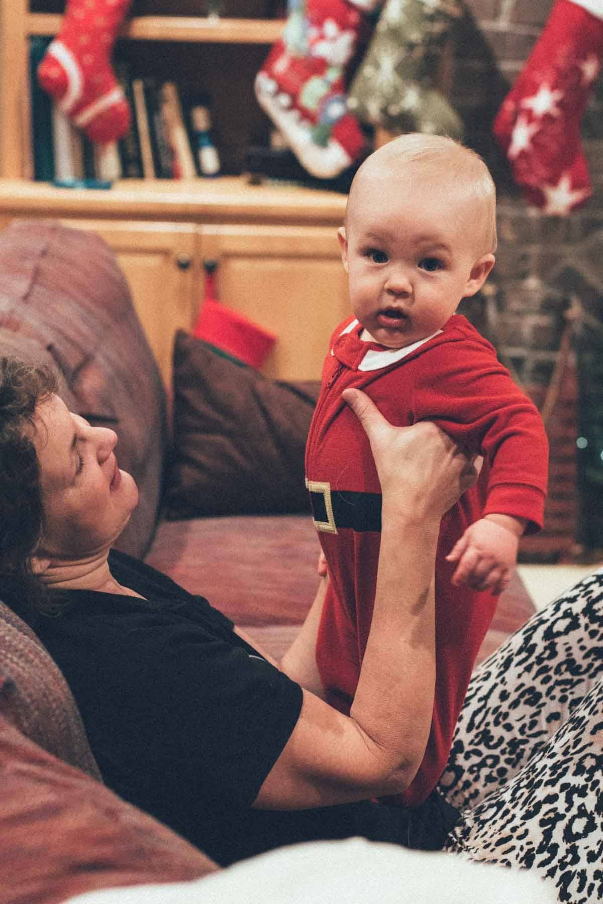 Woman holding a baby.